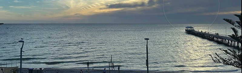 A view from the restaurant of the sea and the jetty.